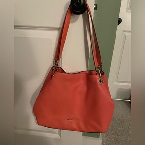 Michael Kors should bag! Color is close to a salmon